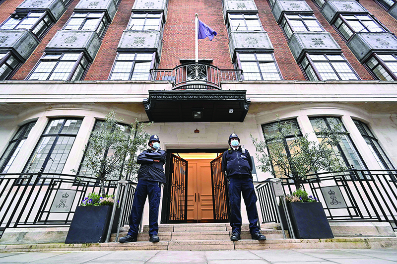 LONDON: Police officers stand on duty outside King Edward VII's Hospital in central London. Queen Elizabeth II spent a night in the private King Edward VII's Hospital after being advised to rest. - AFP