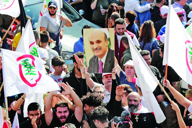 MAARAB, Lebanon: Supporters of Lebanese Forces (LF) leader Samir Geagea gather in front of the ex-warlord's home in his mountain bastion in a show of support yesterday. - AFP n