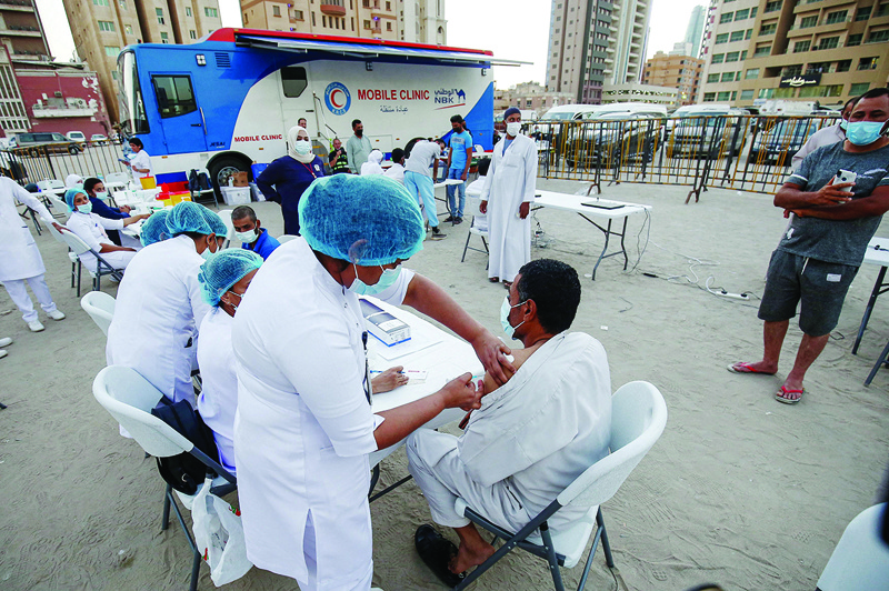 KUWAIT: People are vaccinated against COVID-19 at a field clinic in Bneid Al-Gar on Monday, a day after the health ministry announced it is launching a COVID-19 vaccination campaign across several areas of Kuwait. - Photo by Yasser Al-Zayyat 