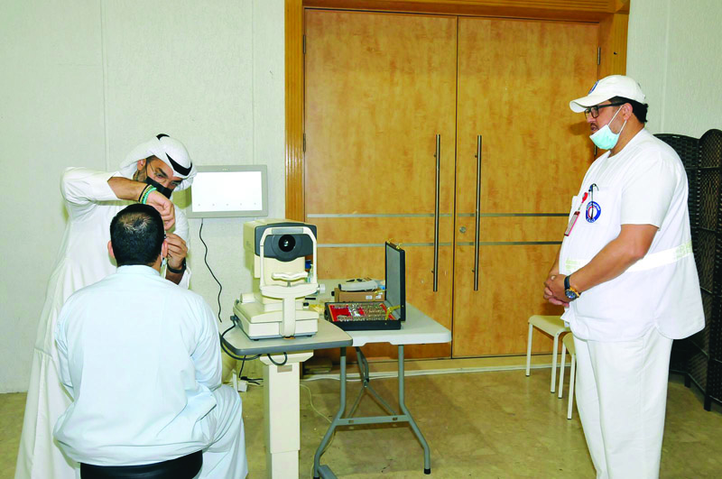 KUWAIT: An optics specialist conducts a check as part of the campaign.nn