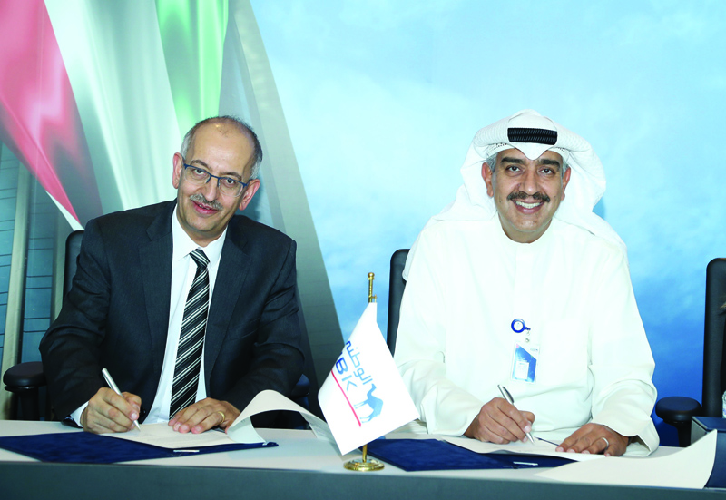 KUWAIT: Emad Al-Ablani, GM - Head of Group Human Resources at National Bank of Kuwait (right), and Dr Khalid Al-Begain, President of Kuwait College of Science and Technology sign the agreement.n