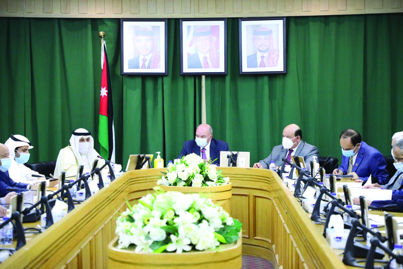 AMMAN: The leader of the Jordanian Senate Faisal Al-Fayez (center) speaks during talks with Kuwait's Ambassador to Jordan Aziz Al-Daihani. - KUNAn
