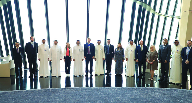 KUWAIT: Lord Mayor of the City of London William Russell poses for a group picture with National Bank of Kuwait officials during a visit to NBK headquarters yesterday.n