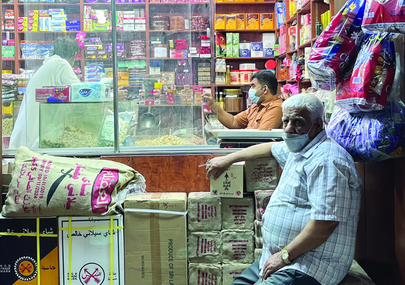 KUWAIT: An elderly vendor is seen at a shop in Souq Mubarakiya. - Photo by Hussain Assadn