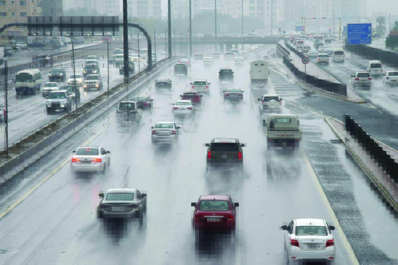 KUWAIT: This file photo shows vehicles driving through rain on a highway in Kuwait. The photo is used for illustration purposes only. - Photo by Fouad Al-Shaikhn