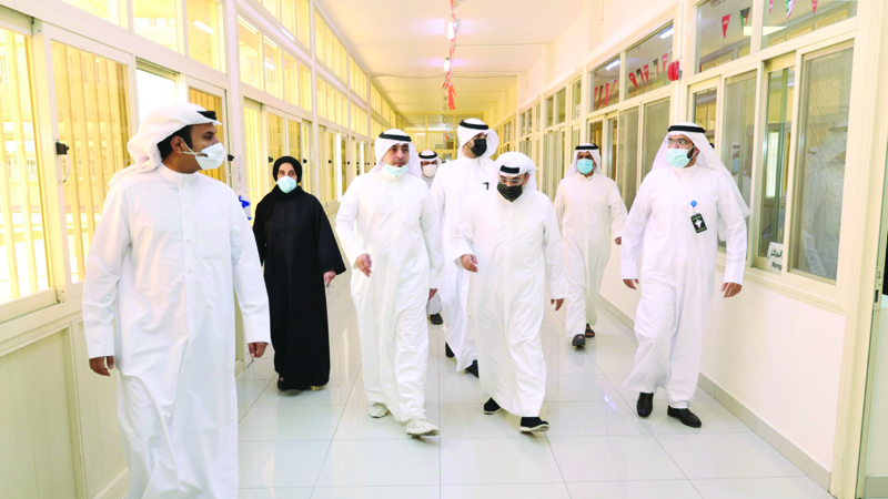 KUWAIT: Ministry of Foreign Affairs and Public Authority for Manpower officials are seen while touring the labor shelter.n