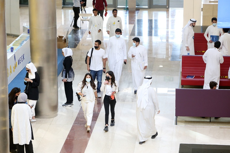 KUWAIT: (Left) Students arrive to attend classes at Kuwait University for the first time in a year and a half after coronavirus restrictions were lifted yesterday. (Right) Passengers are seen at Kuwait International Airport after it resumed operations at full capacity yesterday. - Photos by Yasser Al-Zayyatn
