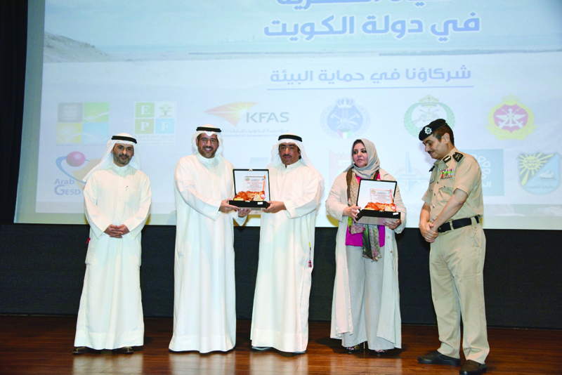 KUWAIT: In this handout photo, officials are seen during a ceremony organized by Kuwait Environment Protection Society to honor partners in a project to release a documentary on Kuwait's wildlife.n