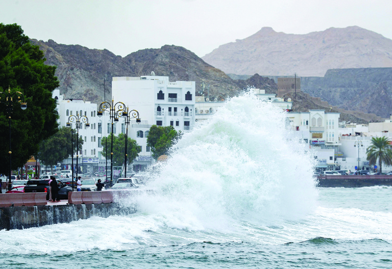 MUSCAT: High waves break on the Mutrah sea side promenade in the Omani capital Muscat yesterday as the Shaheen tropical storm hits the country. - AFP n