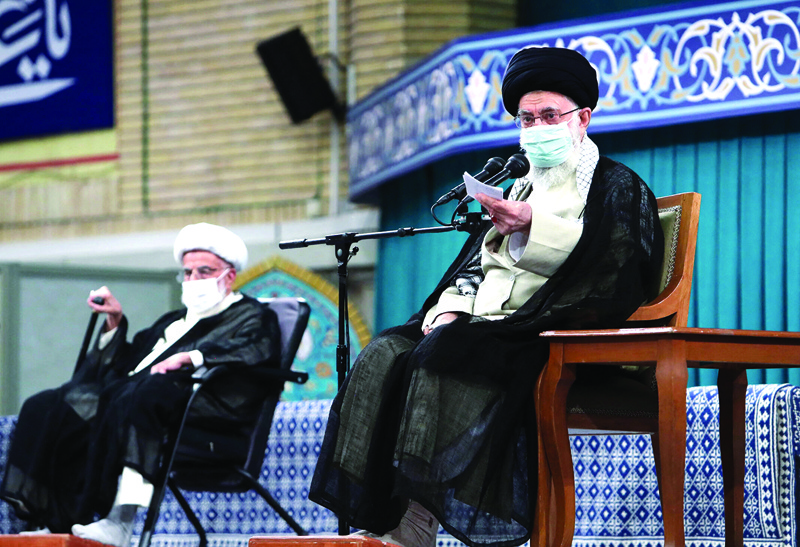 TEHRAN: A handout picture provided by the official website of Iran’s Supreme Leader Ayatollah Ali Khamenei, shows him (right) during a meeting with participants in the Islamic Unity Conference in the capital Tehran yesterday. – AFP n