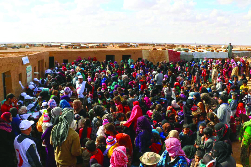 RUKBAN, Jordan: Displaced people receive vaccinations at the Rukban desert camp for displaced Syrians along Syria’s border with Jordan. – AFP n