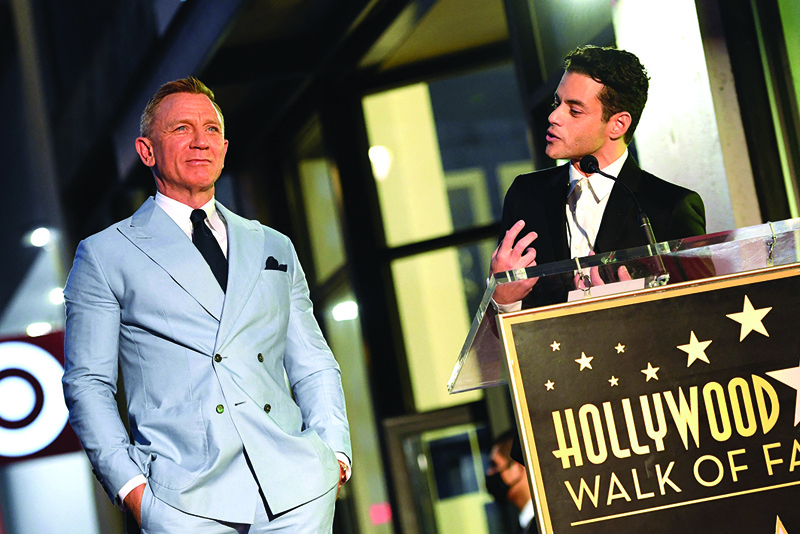 US actor Rami Malek (right) speaks during the ceremony to honor British actor Daniel Craig with a star on the Hollywood Walk of Fame in Los Angeles, California, on October 6, 2021. - AFP n