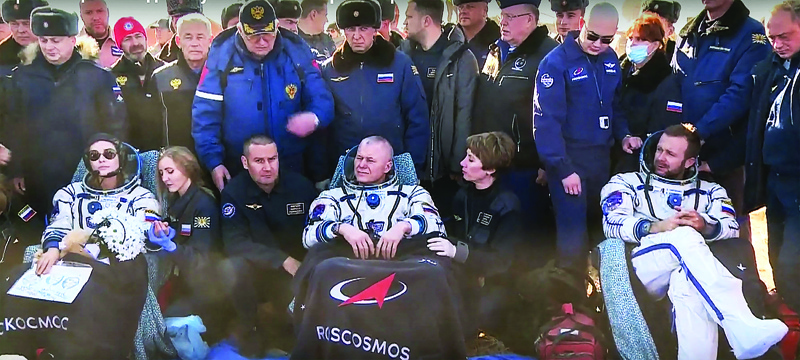 This handout video grab taken and released yesterday by the Russian Space Agency Roscosmos shows crew members Roscosmos cosmonaut Oleg Novitskiy (center), Russian actress Yulia Peresild (left) and film director Klim Shipenko resting in chairs after landing, southeast of the Kazakh town of Zhezkazgan.—AFP photosn