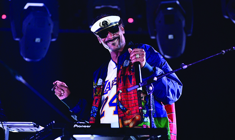 In this file photo DJ Snoopadelic (aka Snoop Dogg) performs on stage during a “Concerts in Your Car” performance at the Ventura County Fairgrounds in Ventura, California. –AFP photosn