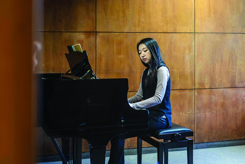 27-year-old Su Yeon Kim from South Korea, one of the finalists of the 18th International Chopin Piano Competition, performs during a rehearsal at the Warsaw Music University in Warsaw, Poland.—AFP photosn