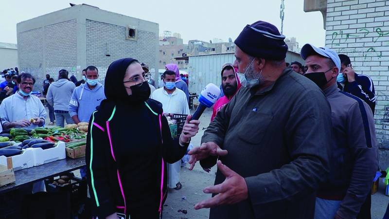 KUWAIT: In this file photo, Kuwaiti journalist Jenan Al-Zaid is seen as she interviews a man while preparing an investigative report in Jleeb Al-Shuyoukh. - KUNA photosn