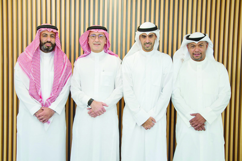 KUWAIT: (From left): Feras Samir Al-Bayyat, Samer Hamdi Al-Zaeem, Eng Bader Nasser Al-Kharafi and Eng Abdulrazaq Zaid Al-Dhbayyan during the signing of the partnership agreement yesterday.nn