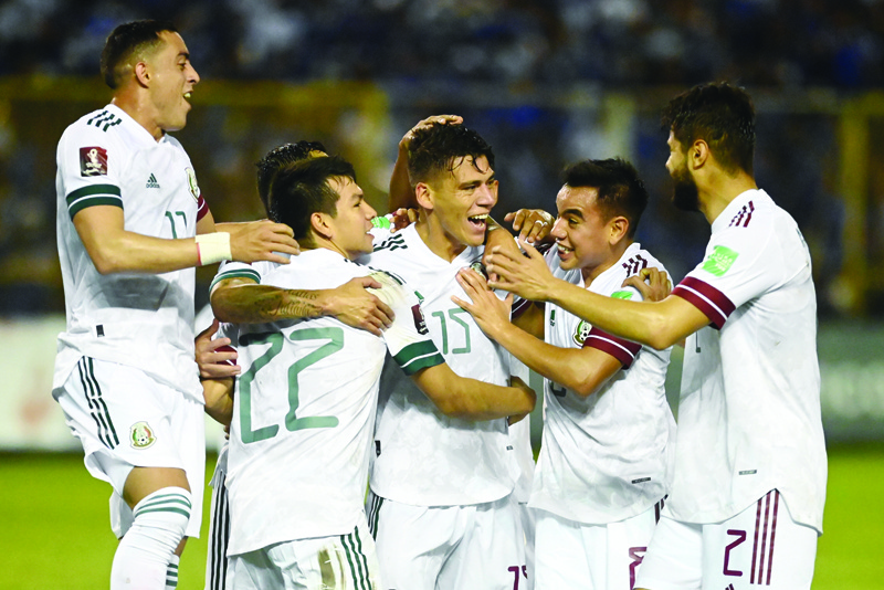 SAN SALVADOR: Mexico's Hector Moreno (center) celebrates with his teammates after scoring against El Salvador during their Qatar 2020 FIFA World Cup Concacaf qualifier football match at Cuscatlan Stadium, in San Salvador, on Wednesday. - AFPn