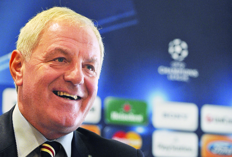 SEVILLE: In this file photo taken on December 08, 2009 Ranger's coach Walter Smith smiles during a press conference in Seville, on the eve of their UEFA Champions League football match against Sevilla. - AFPnn
