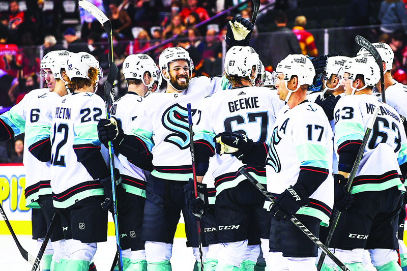 CALGARY: In this file photo taken on September 29, 2021 the Seattle Kraken celebrate after defeating the Calgary Flames 2-1 in shootout during an NHL preseason game at Scotiabank Saddledome in Calgary, Alberta, Canada. – AFPn