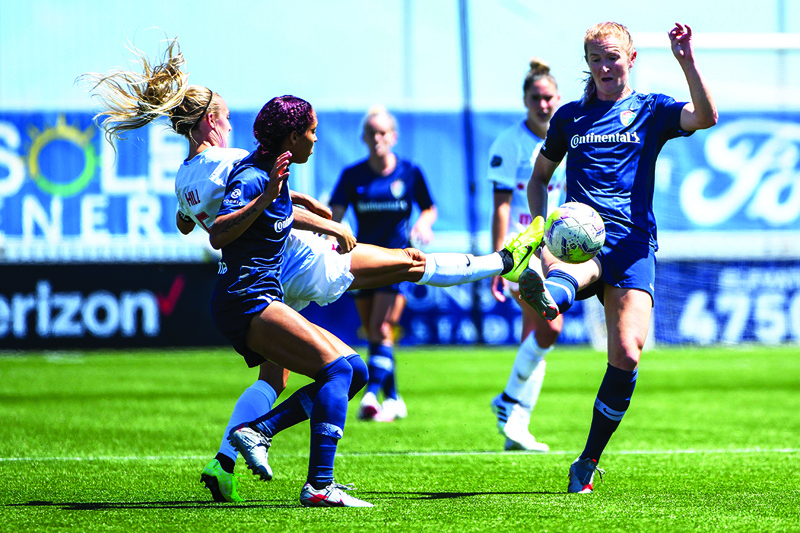 HERRIMAN: In this file photo taken on July 04, 2020 Rachel Hill of Chicago Red Stars (left) and Samantha Mewis of North Carolina Courage (right) fight for the ball during a game on day 5 of the NWSL Challenge Cup at Zions Bank Stadium in Herriman, Utah. – AFPnn