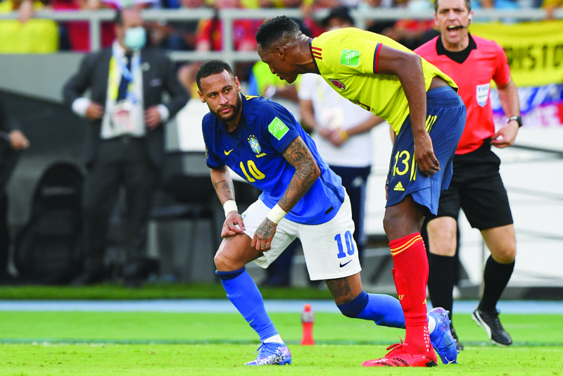 BARRANQUILLA: Brazil's Neymar (left) and Colombia's Yerry Mina are seen during their South American qualification football match for the FIFA World Cup Qatar 2022 at the Metropolitano stadium in Barranquilla, Colombia, on Sunday. - AFPn