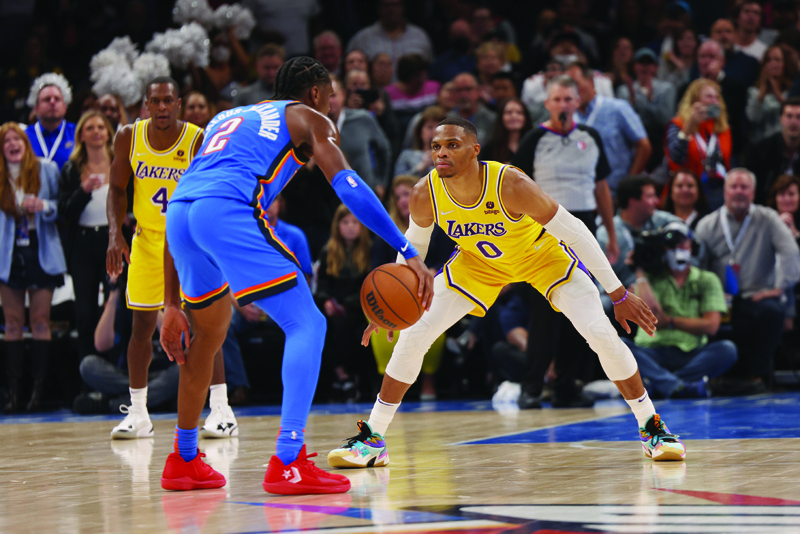 OKLAHOMA CITY: Russell Westbrook #0 of the Los Angeles Lakers plays defense during the game against Shai Gilgeous-Alexander #2 of the Oklahoma City Thunder on Wednesday at Paycom Center. - AFP n