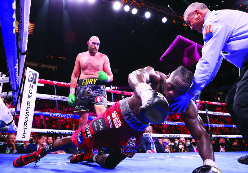 LAS VEGAS: Deontay Wilder (right) is knocked out by Tyson Fury in the 11th round during their WBC heavyweight title fight at T-Mobile Arena on Saturday in Las Vegas, Nevada. - AFPn