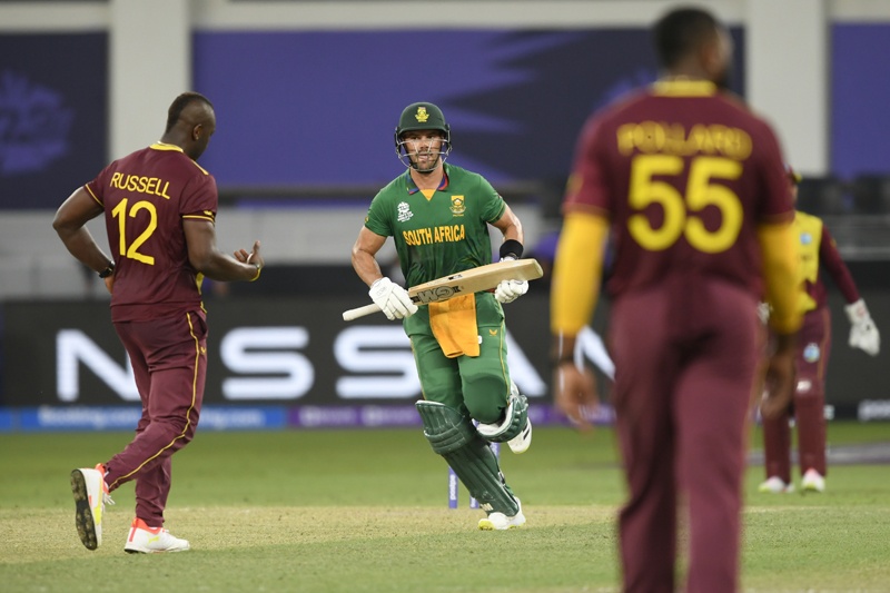 DUBAI: South Africa's Aiden Markram (center) takes the last run to win the ICC men’s Twenty20 World Cup cricket match between South Africa and West Indies at the Dubai International Cricket Stadium in Dubai yesterday. – AFPn
