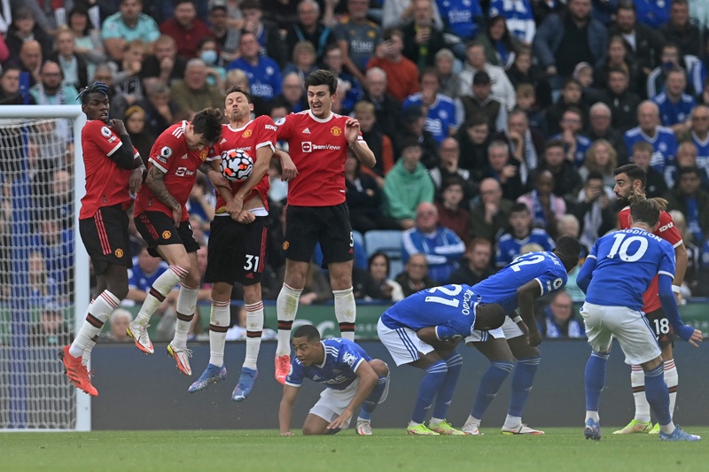 LEICESTER: Leicester City's English midfielder James Maddison (right) fires a free kick into the defensive wall during the English Premier League football match between Leicester City and Manchester United at King Power Stadium yesterday. - AFP n