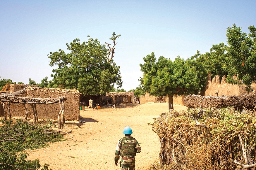OGOSSAGOU: A Senegalese Blue Helmet peacekeeper stands in the village of Ogossagou, Mopti Region. — AFP