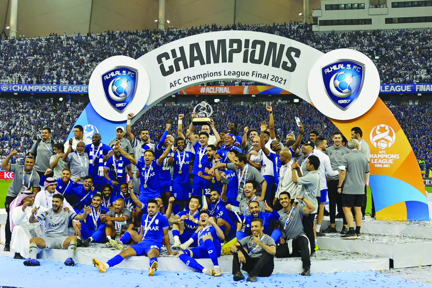 RIYADH: Hilal's players celebrate with the trophy after winning the AFC Champions League final football match against South Korea's Pohang Steelers yesterday. — AFP photos