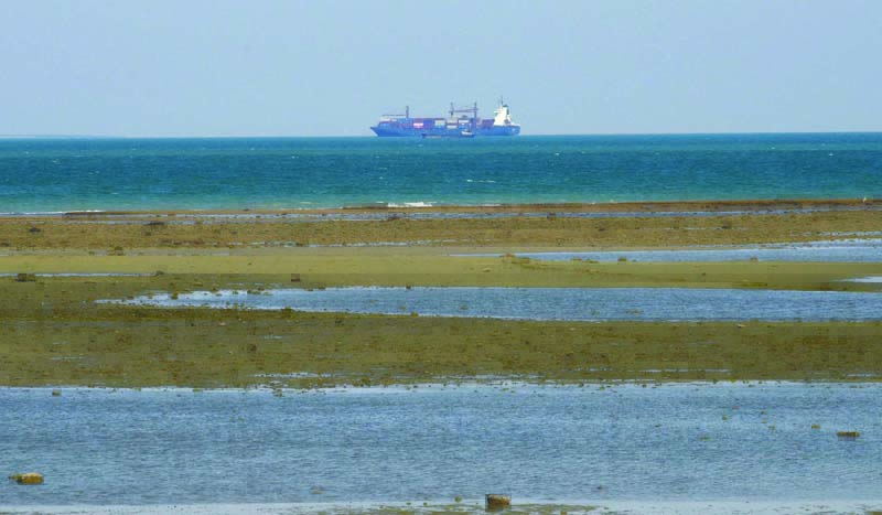 KUWAIT: A photo taken from Kuwait's beach showing a cargo ship in the Arabian Gulf waters. - Photo by Fouad Al-Shaikhn
