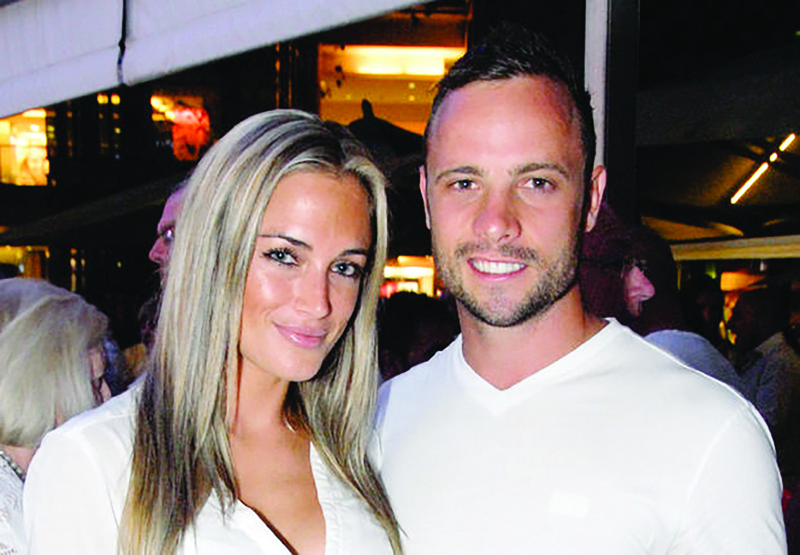 A picture taken on January 26, 2013 shows Olympian sprinter Oscar Pistorius posing next to Reeva Steenkamp at Melrose Arch in Johannesburg. n