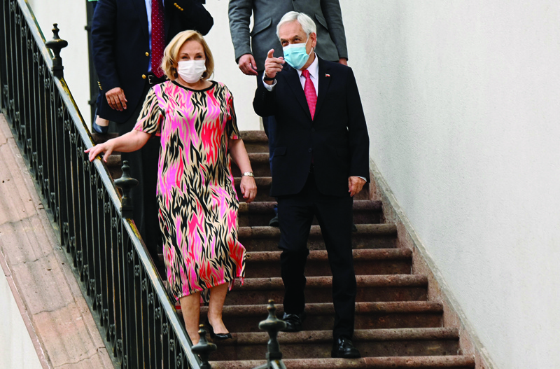SANTIAGO: Chilean President Sebastian Pinera and his wife Cecilia Morel arrive for a press conference at La Moneda presidential palace in Santiago, November 17, 2021. - AFPnnnn