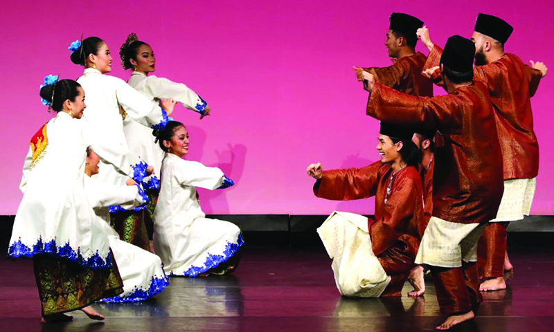 Malaysian dancers perform Zapin, a popular traditional dance with Arabic roots.-KUNA  photosn