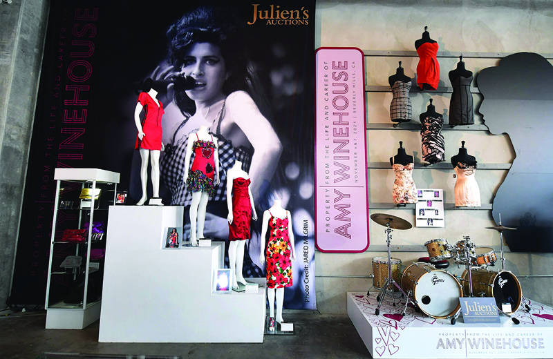A collection of Amy Winehouse dresses and her drum set are displayed at Julien's Auctions in Beverly Hills, California.—AFP photosn