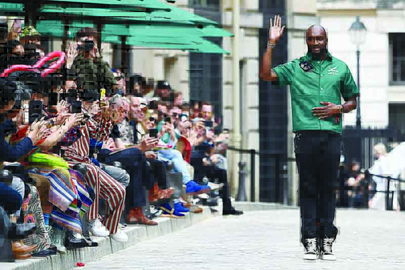 This file photo shows US fashion designer Virgil Abloh acknowledging the audience at the end of the presentation of Louis Vuitton's creation during the men's spring/summer 2020 fashion collection in Paris. -AFP photosn