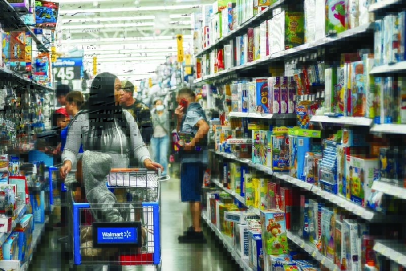 HOUSTON: A customer shops in a Walmart store during Black Friday on November 26, 2021 in Houston, Texas. Retailers are anticipating a busier holiday season than last year after the COVID-19 pandemic caused the quietest Black Friday in 20 years. – AFPn