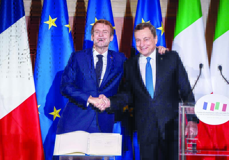 ROME: French President Emmanuel Macron (L) and Italian Prime Minister Mario Draghi shake hands as they hold a joint press conference after signing the Quirinal Treaty between Italy and France. - AFPnnn