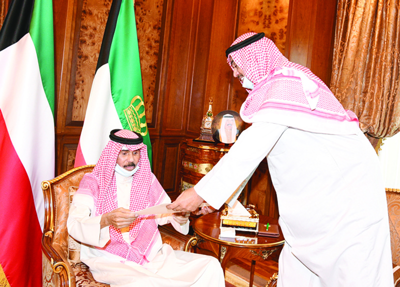 KUWAIT: HH the Prime Minister Sheikh Sabah Al-Khaled Al-Hamad Al-Sabah tenders the government's resignation to HH the Amir Sheikh Nawaf Al-Ahmad Al-Jaber Al-Sabah at Dar Al-Yamamah yesterday. - KUNA n