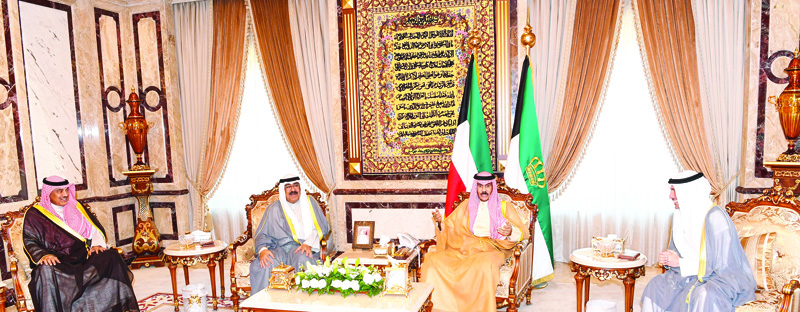 KUWAIT: His Highness the Amir Sheikh Nawaf Al-Ahmad Al-Jaber Al-Sabah meets His Highness the Crown Prince Sheikh Mishal Al-Ahmad Al-Jaber Al-Sabah, Speaker of the National Assembly Marzouq Al-Ghanem (right) and His Highness the Prime Minister Sheikh Sabah Al-Khaled Al-Hamad Al-Sabah (left) at Dar Al-Yamama yesterday. - Amiri Diwan photon