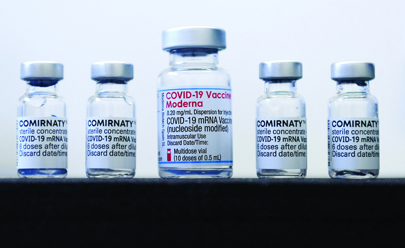 SONTHOFEN: Vials of the COVID-19 vaccines by Pfizer/BioNTech and the Moderna vaccine (center) against the novel coronavirus stand on a table in a vaccination center in Sonthofen, southern Germany,  amid the ongoing COVID-19 pandemic. - AFP n