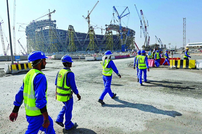 DOHA: Photo shows construction workers at Qatar's Lusail Stadium, one of the Qatar's 2022 World Cup stadiums, around 20 kilometers north of the capital Doha. – AFP n