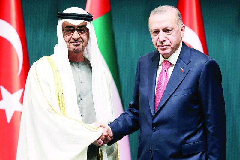 ANKARA: Turkish President Recep Tayyip Erdogan (right) shakes hands with Abu Dhabi's Crown Prince Sheikh Mohammed Bin Zayed Al Nahyan as they attend a signing ceremony regarding the agreements between the two countries yesterday. – AFP n