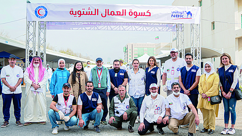 KUWAIT: National Bank of Kuwait and Kuwait Red Crescent Society staff in a group photo.n