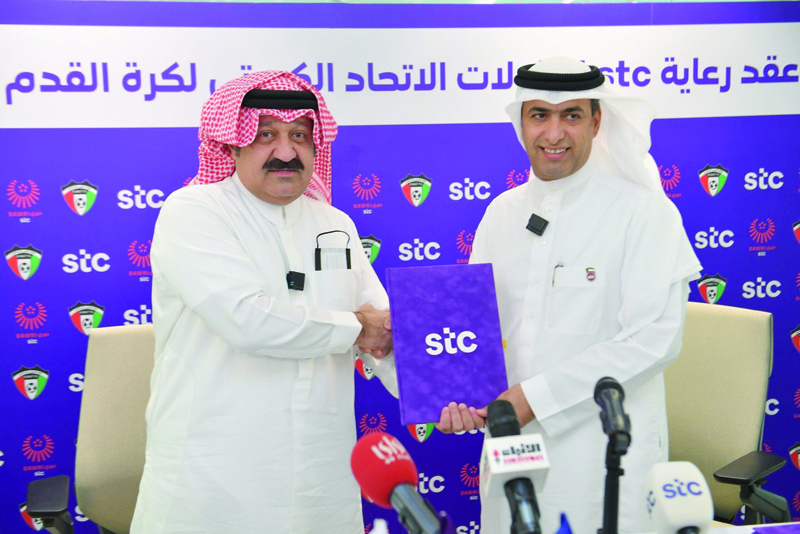 KUWAIT: Sheikh Ahmed Youssef Al-Sabah, President of KFA (left), and engineer Maziad Alharbi, CEO of stc shake hands after signing the agreement.n