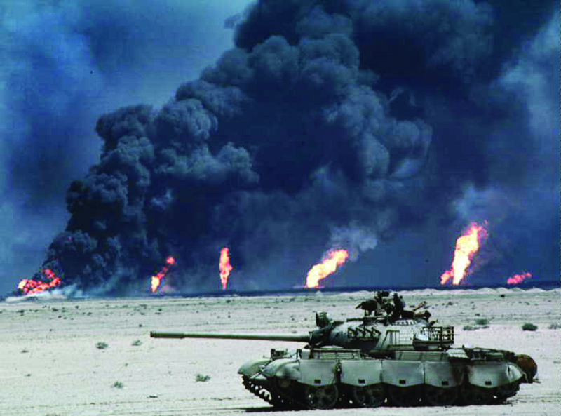 KUWAIT: An archive photo from the Iraqi invasion period showing heavy plumes of smoke billowing from burning oil wells in Kuwait. - KUNAn
