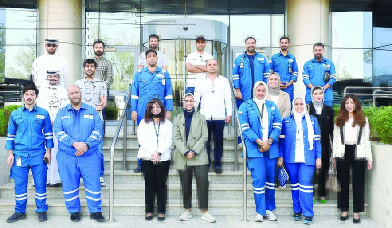 KUWAIT: Kuwait Integrated Petroleum Industries Company (KIPIC) and Zain Innovation Center (ZINC) staff in a group photo at the Zain's main headquarters in Shuwaikh. - KUNAn