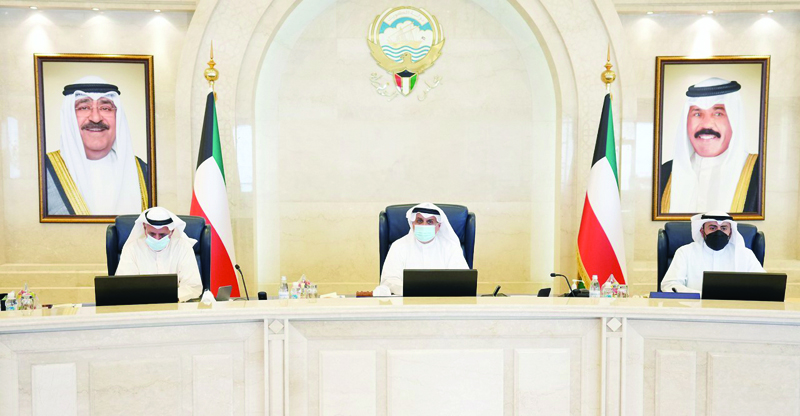 KUWAIT: Acting Prime Minister and Defense Minister Sheikh Hamad Jaber Al-Ali Al-Sabah (center) chairs the Cabinet's meeting. - KUNAn